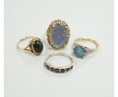 A 1940's 18ct and black opal doublet set dress ring, with diamond chip set shoulders, size L, a 14c and oval doublet ring and