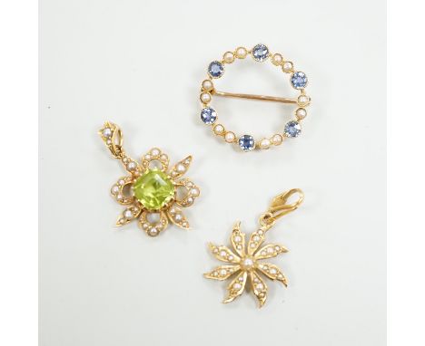Two Edwardian 15ct and gem set pendants including peridot and seed pearl, 27mm and a similar 15ct and gem set open work circu