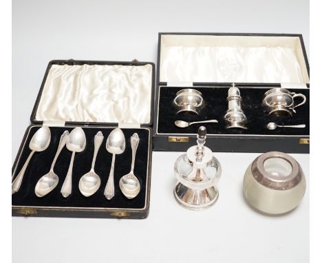 A cased George V silver three piece condiment set with two spoons, London, 1935, a cased set of six silver grapefruit spoons,