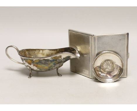 A George V engine turned silver cigarette case, 11.3cm a white metal sauceboat and a Wai Kee sterling pin dish.