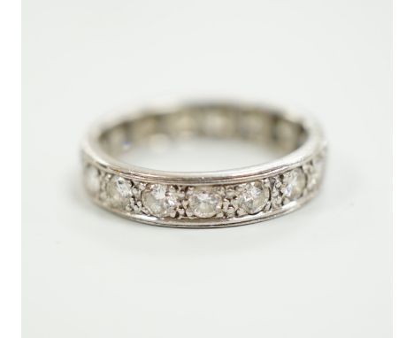 A white metal and diamond set full eternity ring, size M, gross weight 3.9 grams.