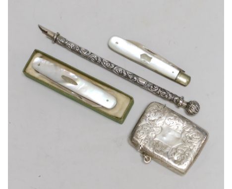 A late Victorian engraved silver vesta case, 53mm, two mother of pearl mounted silver fruit knives and a white metal dip pen.