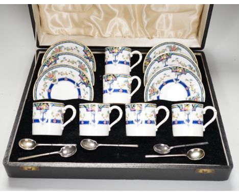 A cased Royal Worcester ‘Orlando’ coffee set with silver spoons,