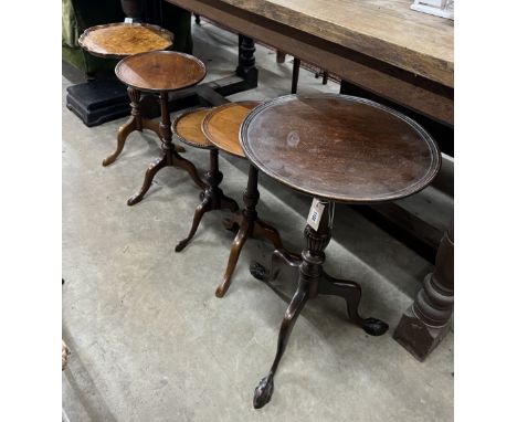 Five early 20th century and later circular mahogany and walnut tripod wine tables, largest diameter 37cm, height 63cm