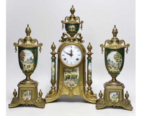 A three piece brass and porcelain clock garniture, clock 43cm high