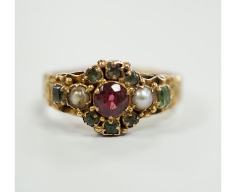 A late Victorian 15ct gold, ruby?, emerald and seed pearl cluster set dress ring, size K, gross weight 2.6 grams, with engrav