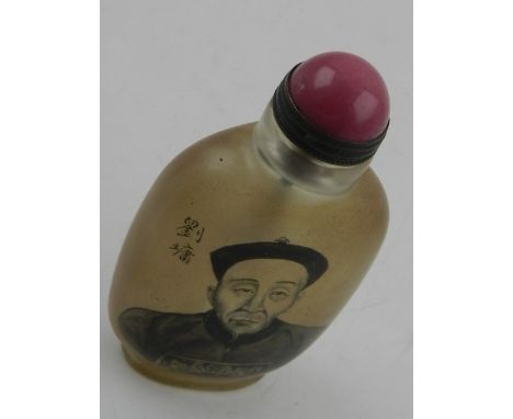 A Chinese reverse painted glass snuff bottle, with a head and shoulder portrait of an elderly gentleman to one side and Chine