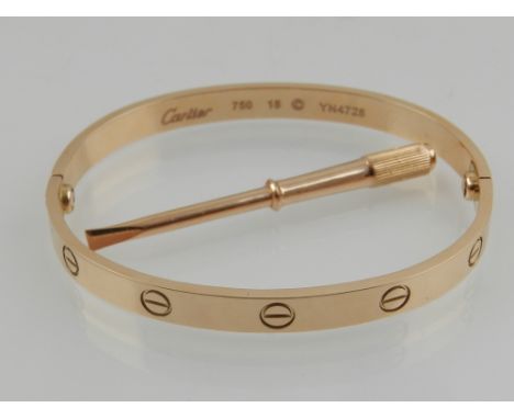 Cartier. An 18 carat rose gold Love bangle, together with original screwdriver. 