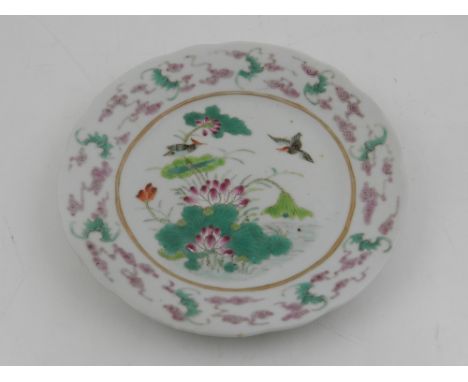 A Chinese doucai small dish, decorated with birds amongst flowers to centre within a band of bats and stylised clouds, with f