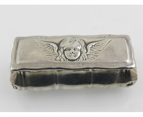 An Art Nouveau silver trinket box, embossed with angel's head to top, gilt interior, hallmarked Henry Matthews Birmingham 190