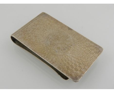 A silver money clip, having engine turned decoration, hallmarked Birmingham 1988, cased 