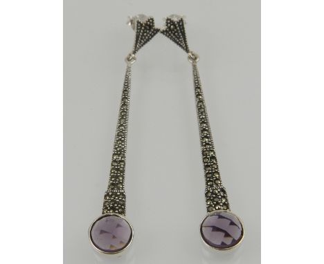 A pair of silver, marcasite, and faceted amethyst drop earrings. 