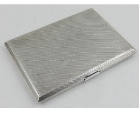 An Art Deco cigarette case, having engine turned design and gilt interior, hallmarked Henry Griffith Birmingham 1931, weight 