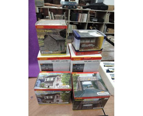 Three Hornby 00 gauge accessories, Platt's store, Railway Bridge and Home Farm, a Bachmann Signal box and three Hornby contro