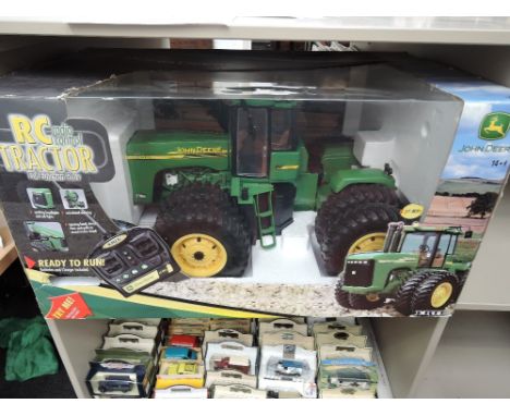 A Ertl  radio controlled John Deere model tractor, boxed