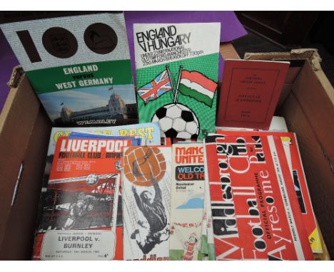 A box of 1960's and later football and cricket ephemera including matchday programmes, handbooks etc