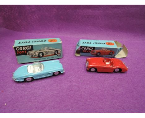 Two Corgi diecasts, Mercedes-Benz 300SL in blue with white interior, boxed 303 and Austin Healy sports car in red, missing wi