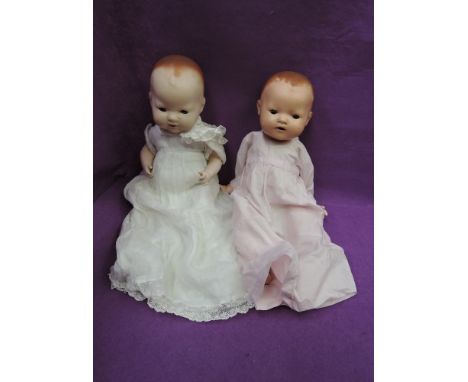 Two mid 20th century Heinrich Handwerck and similar composition dolls having sleep eyes, open mouths and jointed bodies, one 