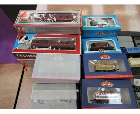 Twenty-three  Bachmann, Lima and Airfix 00 items of rolling stock, all boxed