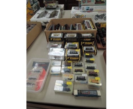 A collection of Graham Farish, Peco and similar N gauge rolling stock and carriages, most boxed, approx 60 and a Lima N gauge