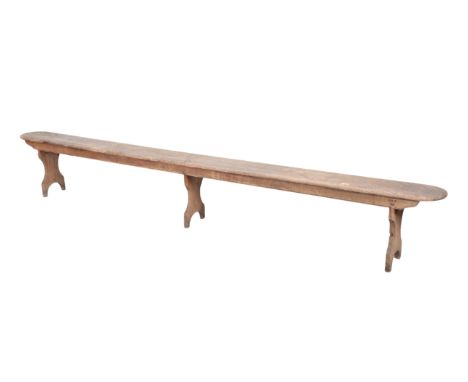 A STAINED PINE TRESTLE BENCH 20th century, 45cm high x 25cm wide x 320cm longProvenance: The Richard Pratley Collection of En