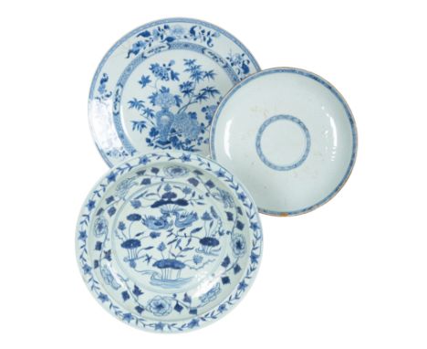 A CHINESE BLUE AND WHITE CHARGER with a six character Kangxi mark to the base, but later, of circular form, decorated with bi