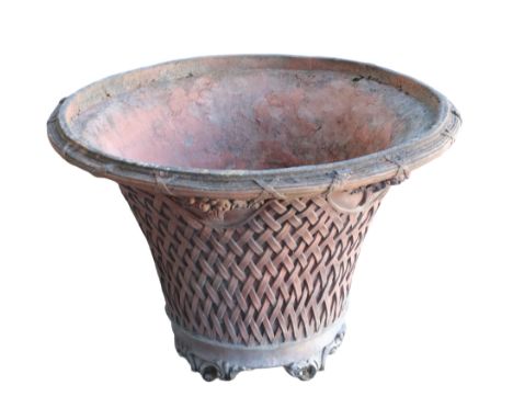 A LARGE TERRACOTTA GARDEN PLANTER of tapered form, with lattice work decoration and applied floral sprays to the body, on scr