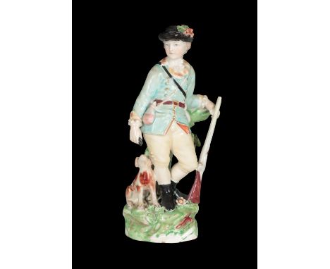 AN 18TH CENTURY DUESBURY &amp; CO DERBY PORCELAIN FIGURE - SPORTSMAN WITH DOG AT FOOT 16cm high, patch marks and incised No. 