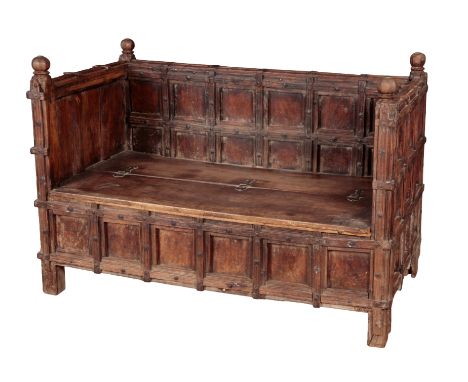 AN INDIAN PANELLED WOOD HALL BENCH with faceted ball finials, lifting seat, on square legs, 102cm high x 150cm wide x 84cm de