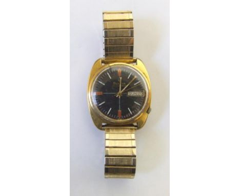 Bulova Accutron Rolled Gold Wristwatch with black dial, day/date, baton markers, gilt hands, sweep second hand, requires batt