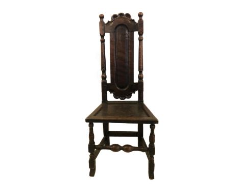 C17th Oak Side Chair, top with frilled carving, turned columns with central oval panel, triangular section wooden seat, turne