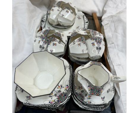 A Shelley porcelain black leaf pattern part tea service number 11575, comprising twelve tea cups, twelve saucers, sugar basin