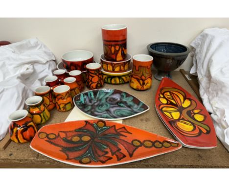 A collection of Poole Pottery vases, bowls and centre dishes in burnt orange colours etc and a studio pottery vase impressed 