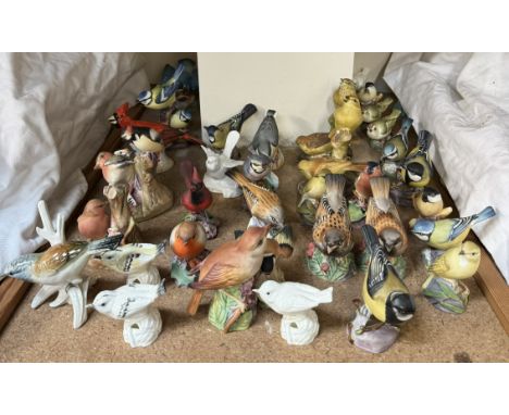 A collection of Royal Worcester model birds together with other model birds etc 
