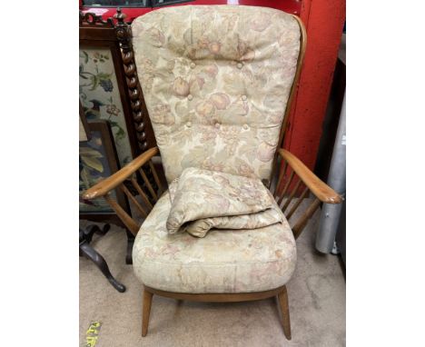 A mid 20th century elbow chair with stick back and sides on tapering legs    CONDITION REPORT:  All furniture manufactured po