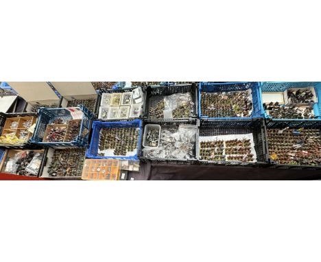 A large collection of hand painted and unpainted model soldiers with guns, pikes, flags, horses etc 