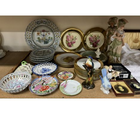 A pair of Continental porcelain figures together with rose and fruit decorated plates, Portuguese plates, bird figures, portr