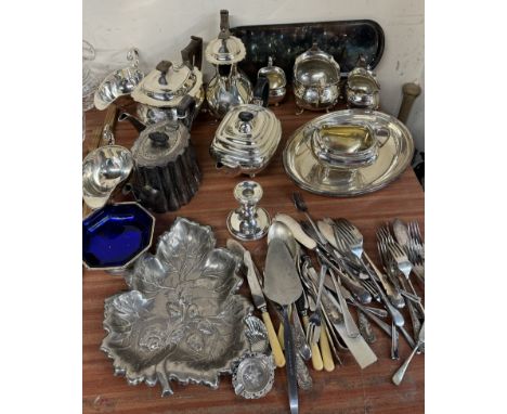 An electroplated four piece tea service together with electroplated sauce boats, flatwares etc 
