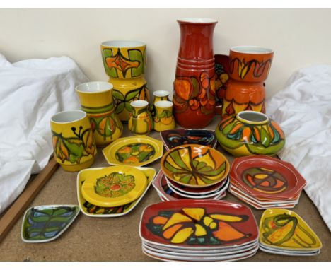 Assorted Poole pottery Delphis pattern yellow ground vases and plates together with a large collection of Poole pottery vases