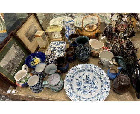 A Meissen porcelain blue and white plate together with copper lustre jugs, Poole pottery dolphin, porcelain doll, clock, teap