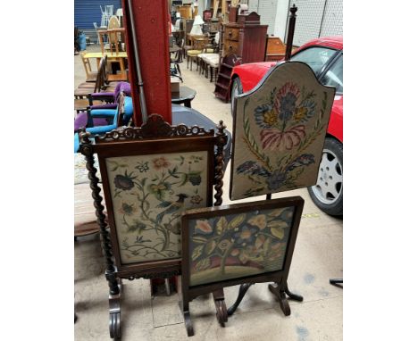 A 19th century mahogany pole screen with a shield shaped woolwork panel on a tripod base together with a Victorian mahogany f