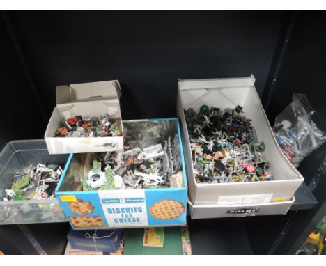 A shelf of 1990's Games Worshop figures, plastic and cold painted