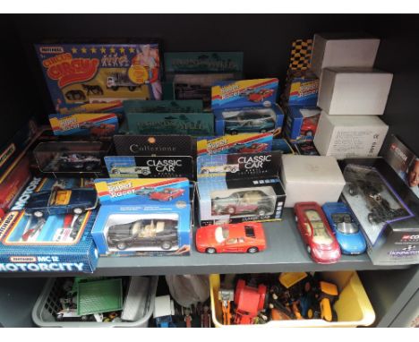 A shelf of mixed vintage diecasts including Matchbox Motorcity, Super Racer, Classic Car etc, most boxed