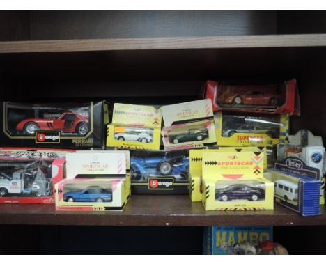 A shelf of modern diecasts including Burago 1:18 scale Ferrari's, Maisto Sportscar collection, Majorette etc all boxed 