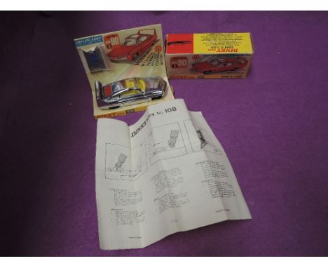 A Dinky Toys diecast, Sam's Car in silver with yellow interior, working friction driven motor on card display stand with inst