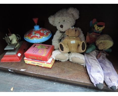 A shelf of mixed toys including Little Betty Senior childs sewing machine, tin plate spinning top, modern teddy bears etc