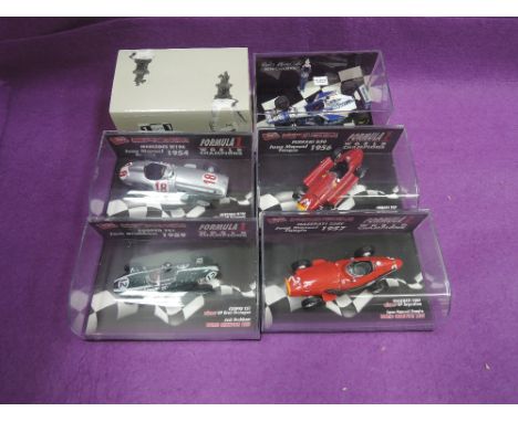 Four Brumm 1:43 scale limited edition diecasts, Mercedes W196, Ferrari D50, Cooper T51 and Maserati 250F all in plastic displ