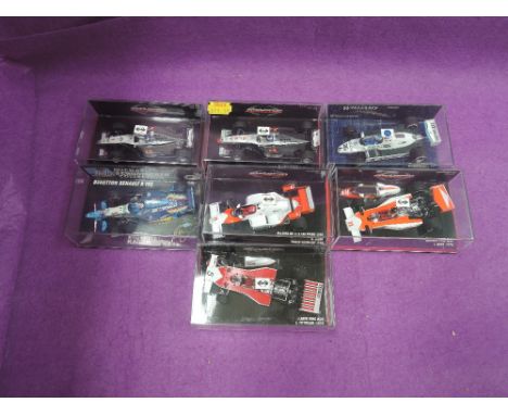 Seven Minichamp and similar 1:43 scale diecast F1 racing cars, Mclaren, Williams and Benettton, all in plastic display cases