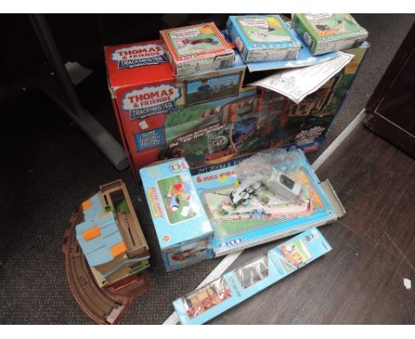 A selection of ERTL, Fisher Price and similar Thomas the Tank Engine toys and sets. Most boxed