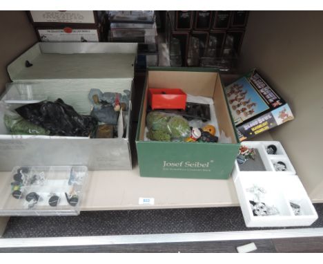 A shelf of Games Workshop and similar plastic and metal figures including Blood Bowl part set, boxed, Black Orc Command in bl